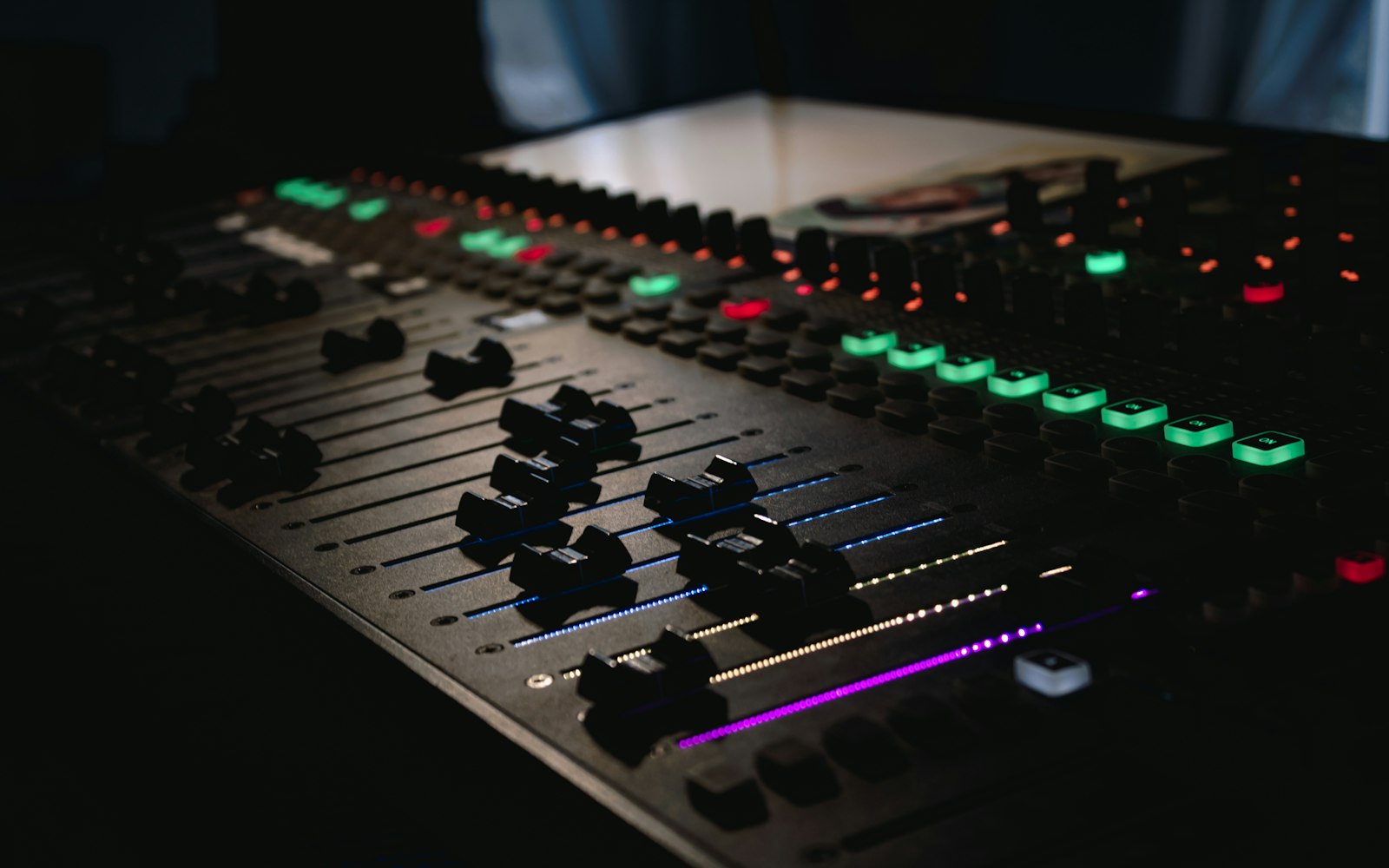 Illuminated faders of a live sound mixing desk