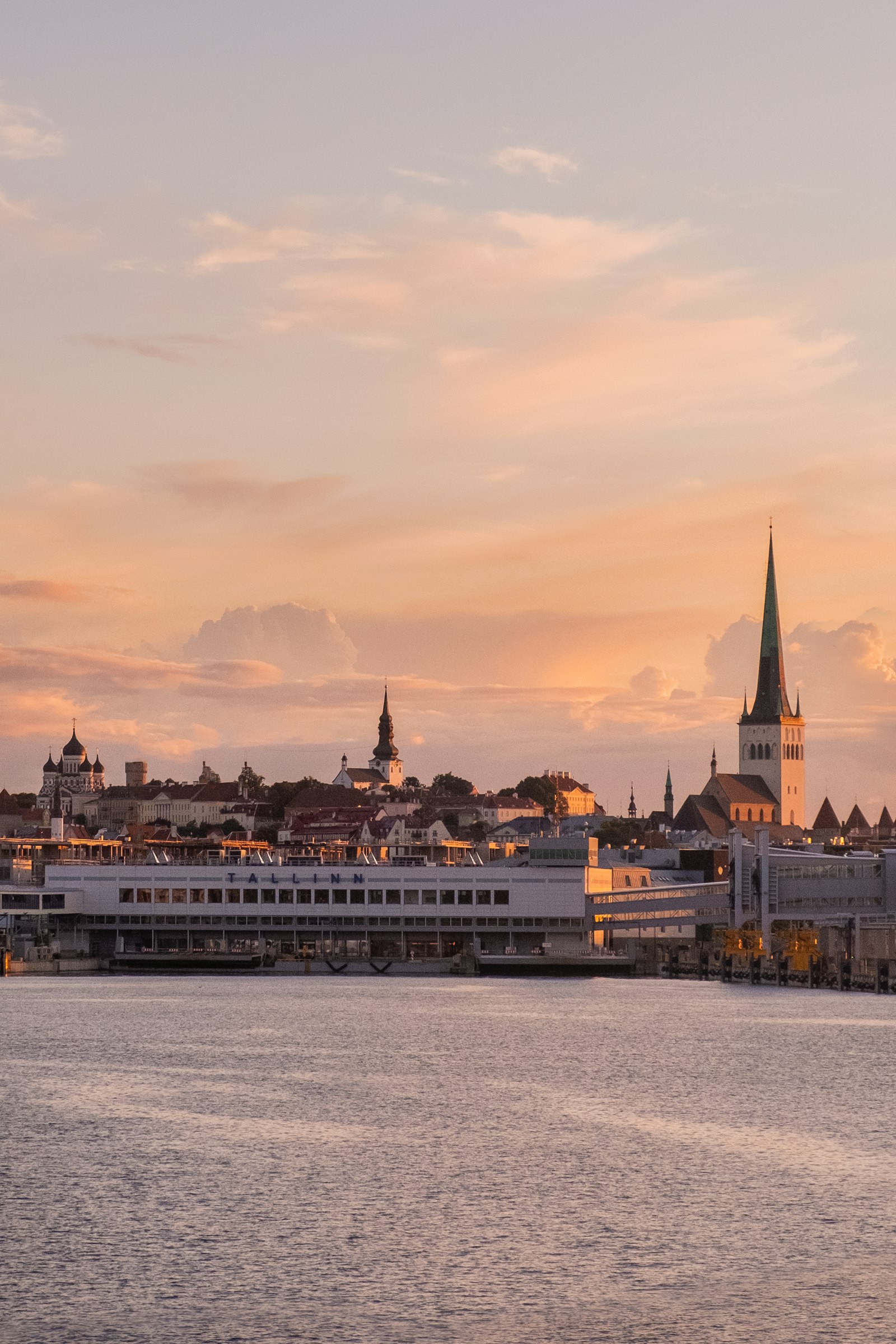 Tallinn old town skyline at sunset seen from the sea